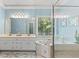 Bright, large bathroom with a view of a soaking tub, shower with glass door and double vanity at 120 Ashewoode Downs Ln, Alpharetta, GA 30005
