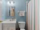 Comfortable bathroom featuring well-lit mirror and a shower with curtain at 120 Ashewoode Downs Ln, Alpharetta, GA 30005
