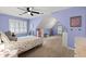 Bright bedroom with a sloped ceiling and a window in the middle at 120 Ashewoode Downs Ln, Alpharetta, GA 30005
