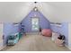 Fun bedroom with sloped ceiling and view of a window with toys and accessories at 120 Ashewoode Downs Ln, Alpharetta, GA 30005