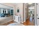 Hallway with hardwood floors and access to living, dining, and other areas of the home at 120 Ashewoode Downs Ln, Alpharetta, GA 30005