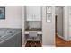 Cozy office nook with granite desk, built-in cabinets, and gray swivel chair at 120 Ashewoode Downs Ln, Alpharetta, GA 30005