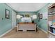 Dedicated home office space featuring built-in shelving, a vaulted ceiling, and ample natural light at 120 Ashewoode Downs Ln, Alpharetta, GA 30005