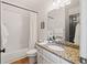 Clean bathroom featuring granite counters, a shower-tub combo and a neutral color palette at 2030 Darien Park Dr, Roswell, GA 30076