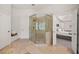 Open bathroom with glass shower and open doorway to the main bedroom at 2030 Darien Park Dr, Roswell, GA 30076