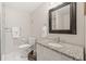 Clean bathroom featuring a granite vanity, brushed nickel fixtures, and updated flooring at 2030 Darien Park Dr, Roswell, GA 30076
