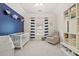 Bright bedroom has a blue accent wall and is styled with fun decor at 2030 Darien Park Dr, Roswell, GA 30076