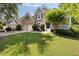 Beautiful front lawn and exterior view of this brick two-story home with white trim at 2030 Darien Park Dr, Roswell, GA 30076