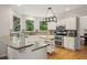 Bright kitchen features white cabinets, a granite countertop and stainless steel appliances at 2030 Darien Park Dr, Roswell, GA 30076