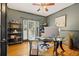 Dedicated home office featuring hardwood floors, ample natural light, and built-in shelving at 2030 Darien Park Dr, Roswell, GA 30076