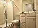 Full bathroom with a walk-in shower, toilet, and vanity with drawers and cabinets at 261 Mahone Dr, Lilburn, GA 30047