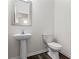 Half bathroom featuring white fixtures and clean lines at 261 Mahone Dr, Lilburn, GA 30047