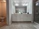 Bathroom with double vanity and tile flooring at 261 Mahone Dr, Lilburn, GA 30047