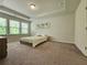 Bright bedroom featuring neutral walls and large windows with natural light at 261 Mahone Dr, Lilburn, GA 30047