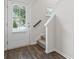 Bright foyer showcasing a stairway and entry door with natural light at 261 Mahone Dr, Lilburn, GA 30047
