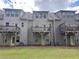 Townhome exterior with wooden balconies at 261 Mahone Dr, Lilburn, GA 30047