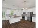 Modern kitchen with stainless steel appliances, granite counters and island at 261 Mahone Dr, Lilburn, GA 30047