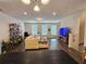 Open-concept living room with hardwood floors, neutral paint, and modern furniture at 261 Mahone Dr, Lilburn, GA 30047