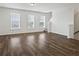 Spacious living room with hardwood floors, large windows, and ample natural light at 261 Mahone Dr, Lilburn, GA 30047