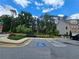 A well landscaped parking area with designated handicap parking near community mailboxes at 261 Mahone Dr, Lilburn, GA 30047
