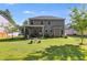 Two-story home with well-maintained backyard, patio, and lush landscaping at 525 Clinton Dr, Temple, GA 30179