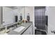 Bathroom with a white vanity, gray countertop, and combined shower and bathtub at 525 Clinton Dr, Temple, GA 30179