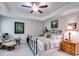 Bedroom featuring carpet, neutral paint, fan, chair and windows at 525 Clinton Dr, Temple, GA 30179