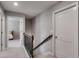 Upstairs hallway with carpet, white trim, and views into the bedrooms at 525 Clinton Dr, Temple, GA 30179