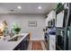 Modern kitchen featuring stainless steel appliances, white cabinets, and a sink with a quartz countertop at 525 Clinton Dr, Temple, GA 30179