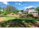 Spacious backyard with lush lawn, mature trees, great for outdoor activities and relaxation at 101 Morgan Ln, Canton, GA 30115