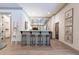 Stylish home bar with four stools, marble countertop, mirrored backsplash, and stainless steel appliances at 101 Morgan Ln, Canton, GA 30115