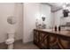 Modern bathroom with an ornate wood vanity, stylish decor, and decorative fixtures at 101 Morgan Ln, Canton, GA 30115