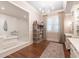 Spacious bathroom with a soaking tub, walk-in shower, and elegant vanity, offering a luxurious spa-like experience at 101 Morgan Ln, Canton, GA 30115