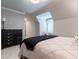 Bright bedroom with modern decor, featuring sloped ceilings and plenty of natural light at 101 Morgan Ln, Canton, GA 30115