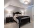 Cozy bedroom featuring neutral walls, side tables with lamps, and a statement chandelier at 101 Morgan Ln, Canton, GA 30115