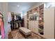 Organized walk-in closet with custom shelving, drawers, and ample hanging space, providing an efficient storage solution at 101 Morgan Ln, Canton, GA 30115