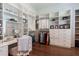 Spacious walk-in closet with custom shelving, drawers, vanity and ample storage for clothes and accessories at 101 Morgan Ln, Canton, GA 30115