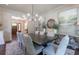 Elegant dining room with a modern chandelier, hardwood floors, and neutral décor at 101 Morgan Ln, Canton, GA 30115