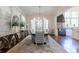 Formal dining room featuring large windows, modern chandelier, and hardwood flooring at 101 Morgan Ln, Canton, GA 30115