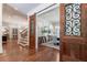 Elegant foyer with decorative wood door, hardwood floors, and staircase access at 101 Morgan Ln, Canton, GA 30115