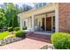 Charming front entrance featuring brick steps, a covered porch, and elegant double doors, welcoming visitors at 101 Morgan Ln, Canton, GA 30115