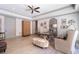 Bright home office featuring a ceiling fan, natural light, a decorative cabinet and stylish furnishings at 101 Morgan Ln, Canton, GA 30115
