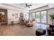 Bright home office featuring a ceiling fan, natural light, stylish furnishings, and access to a patio at 101 Morgan Ln, Canton, GA 30115