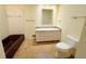 Bathroom features a bathtub, a single sink with granite countertop, a toilet, and tile flooring at 125 Cannongate Cir, Sharpsburg, GA 30277