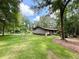Well-manicured lawn and mature trees frame this cozy home at 125 Cannongate Cir, Sharpsburg, GA 30277
