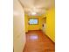 Well-lit laundry room with white cabinets, wood flooring and a window at 125 Cannongate Cir, Sharpsburg, GA 30277