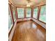 Charming sunroom filled with light through numerous windows and hardwood floors at 125 Cannongate Cir, Sharpsburg, GA 30277