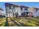 Spacious backyard featuring a pergola and lush lawn with a white fence, perfect for outdoor gatherings at 3258 Kessock Ridge Trl, Snellville, GA 30039