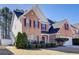 Charming two-story brick home with manicured landscaping and a welcoming entrance at 3258 Kessock Ridge Trl, Snellville, GA 30039