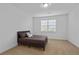 Cozy bedroom features a bed with decorative pillows and a window with blinds at 4089 Thorndale Ln # 13, Smyrna, GA 30080